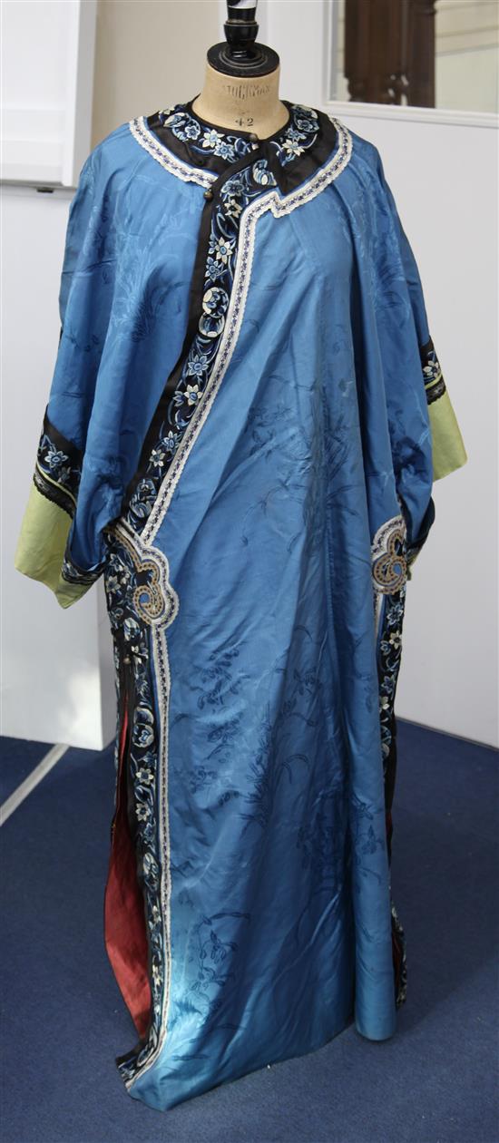 A Chinese blue silk, damask and embroidered ladys robe, late 19th / early 20th century,